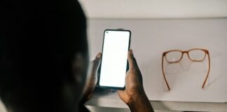 person holding white android smartphone