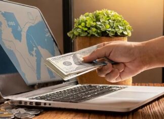 How to Maximize the Value of Your Remittances This Father’s Day hand use the laptop to pay online for bill payment