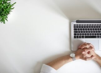 The Future of Work: Embracing the Online Economy to Make Money person wearing watch near laptop