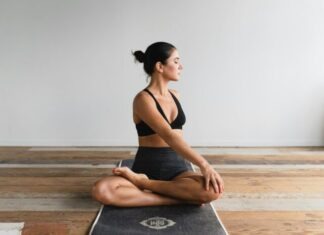 All You Need To Know About Finding The Best Yoga Mat in 2024 woman performing yoga