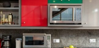 silver microwave oven on black marble counter top
