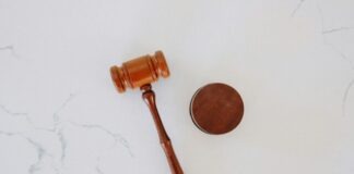 brown wooden smoking pipe on white surface