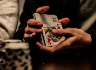 How to Handle Losing Streaks: Financial Tips for Inclave Casino Players? person holding king of spade playing card