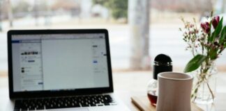 a laptop and a pen on a table