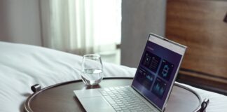 laptop on brown wooden table