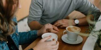 two mugs with coffee on table