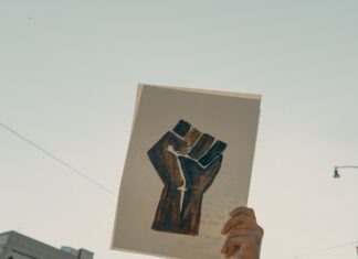 Justice for All: Understanding Wrongful Death Lawyers’ Mission person holding brown wooden frame