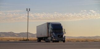 black truck on road during daytime