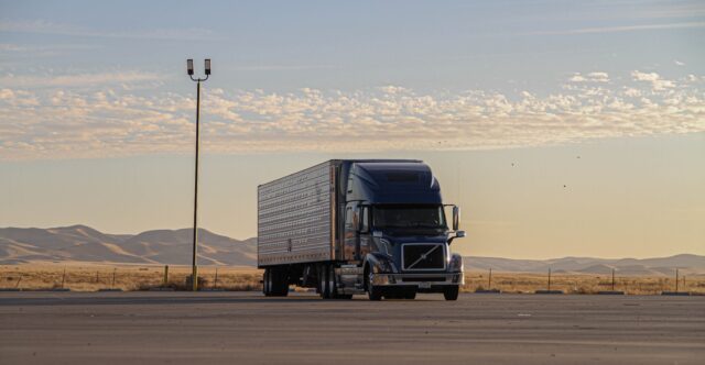 Photo by Sander Yigin black truck on road during daytime