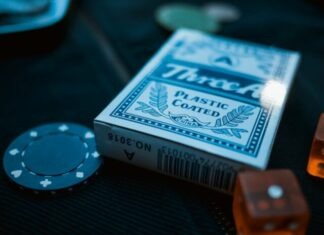 How to Build a Winning Online Poker Strategy TreeA plastic coated card deck beside poker chip and dice