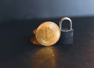 Various Applications of Crypto Payments in Daily Life: A Comprehensive Guide a bit coin sitting on top of a padlock