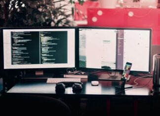 How to Ensure Data Safety During Digital Transformation Initiatives two black computer monitors on black table