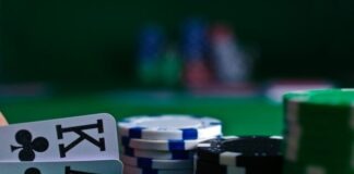 white and black dice on green table