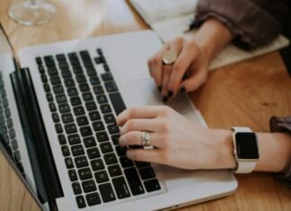 Tackling Spam and Scam in Online Dating: VictoriaBrides Trust & Safety Review person using MacBook