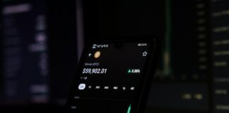 a cell phone displaying a stock chart on the screen