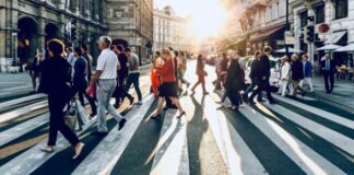 group of people walking on pedestrian lane