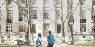 a couple of people that are standing in front of a building