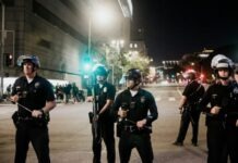 Why a Blanket Negative Perception of Law Enforcement Isn’t Accurate man in black shirt and pants holding black dslr camera