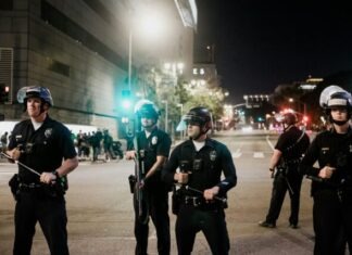 Why a Blanket Negative Perception of Law Enforcement Isn’t Accurate man in black shirt and pants holding black dslr camera