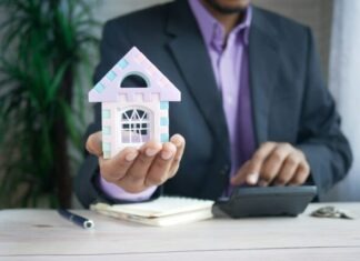 The Importance of Seeking Local Professional Advice When Buying a House man in purple suit jacket using laptop computer