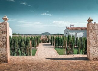 Upgrade Your Property’s Security with the Flexibility of Fold Down Bollards white and brown concrete house near green trees under blue sky during daytime