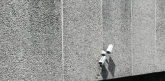 bullet security camera on concrete wall