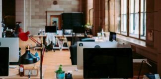 black flat screen computer monitor on brown wooden table