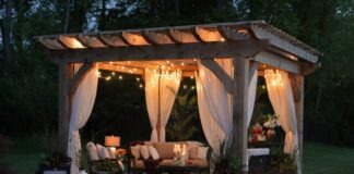 photo of gazebo with curtain and string lights