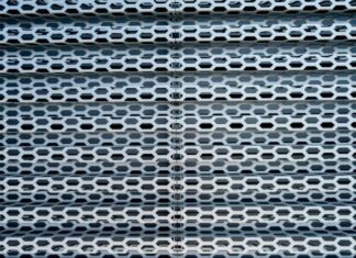 Benefits of Buying Online Mesh Tarp a close up of a metal structure with holes