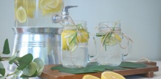 a couple of lemons sitting on top of a cutting board