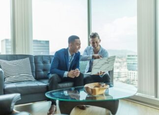 What to Look for in a Trade Finance Facility Before Partnering With Them two men in suit sitting on sofa