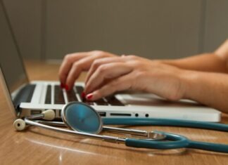 Trends in Online Prescription: What’s Next for Australian Healthcare? person sitting while using laptop computer and green stethoscope near