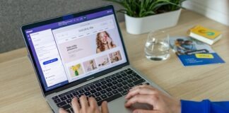 a person typing on a laptop on a table