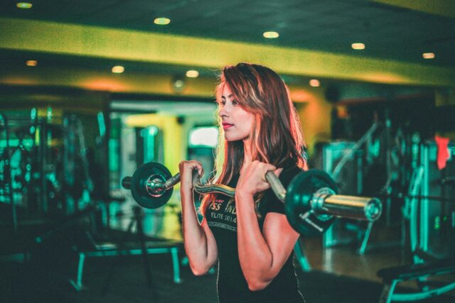 Photo by Gursimrat Ganda woman lifting black and gray barbell