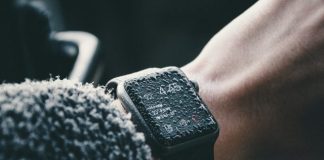 black Apple Watch at 4:45