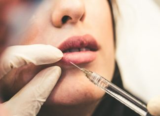 Why More People Are Opting for Deep Plane Facelifts woman holding pen and white cotton candy