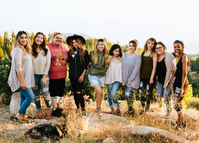 Photo by Omar Lopez group of women standing on rock fragment
