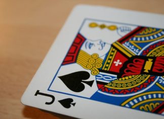 a close up of a playing card on a table