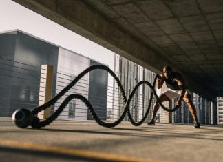 Supplement Essentials: Exploring Top-Selling Formulas for Enhanced Fitness and Well-Being woman in black tank top sitting on brown wooden bench