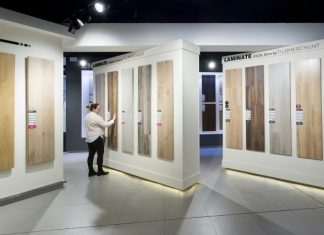 Perfect Displays Fuel More Accurate Consumer Insights in Focus Rooms a man standing in front of a display of wooden doors