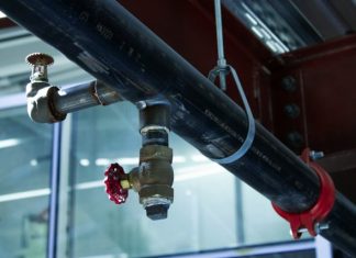 The Ultimate Guide To Choosing the Right Plumbing Fixtures and Equipment a couple of pipes connected to a building