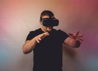 VRSpy: The Future of Immersive VR Technology a man in a black shirt is using a virtual device