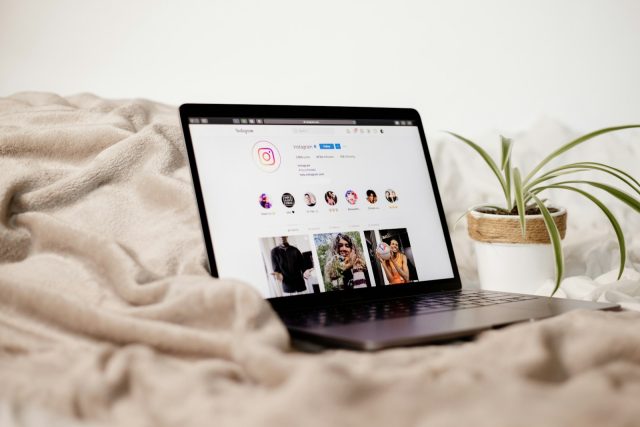 Photo by Collabstr a laptop computer sitting on top of a bed