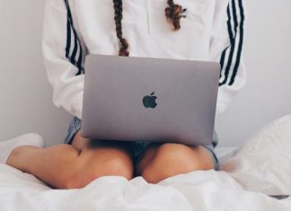Beyond the Screen: How Personal Video Chats Are Redefining Intimate Connections in 2025 woman in white and black long sleeve shirt using silver macbook