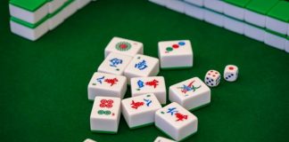 a group of dices sitting on top of a green table
