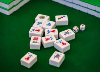 a group of dices sitting on top of a green table