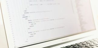turned on MacBook Air displaying coding application