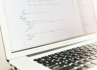 Hosting Trends to Watch in 2025 turned on MacBook Air displaying coding application