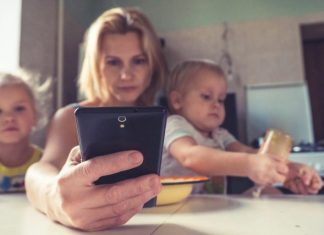 Navigating Digital Socialization as a Parent: Finding the Balance woman in white shirt holding black ipad
