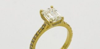 gold ring on white surface